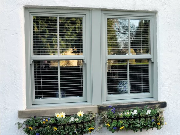 Grey-Green sliding sash windows with Georgian bars